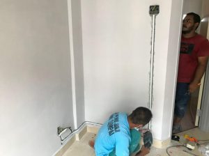 hacking wall to make way for water heater wiring