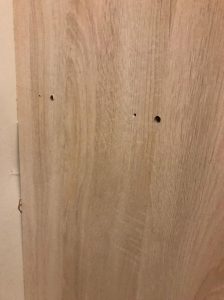 put wood putty on holes at wardrobe