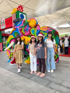 posing in front of lego elephant